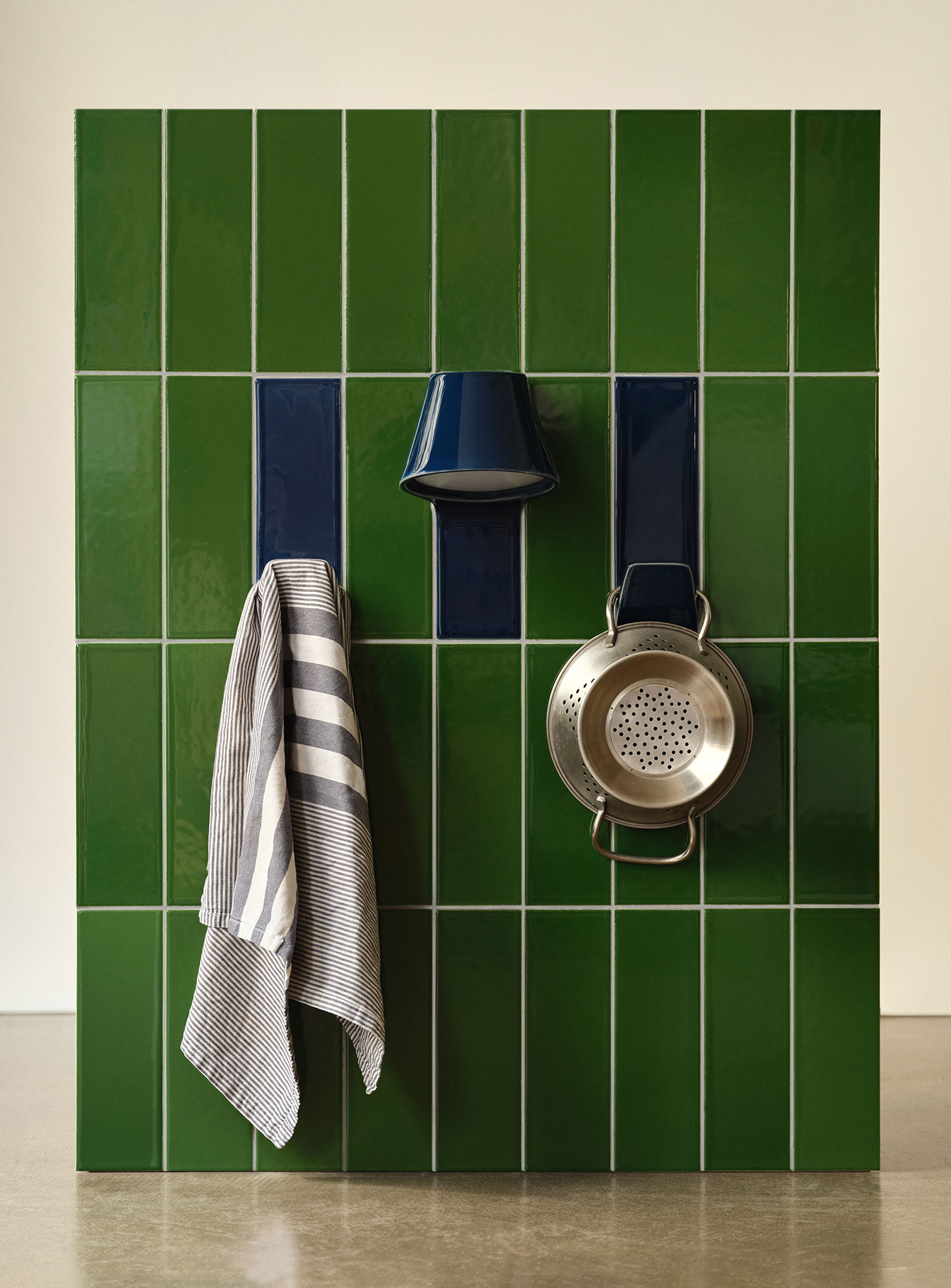 The flush wall lamp and hook offer customizable combinations of color and function