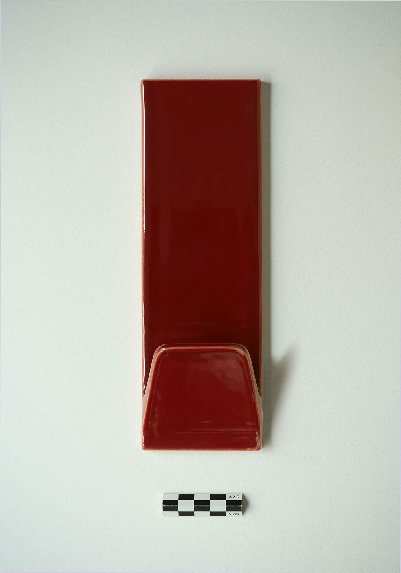 A rosewood ceramic hanger packshot.