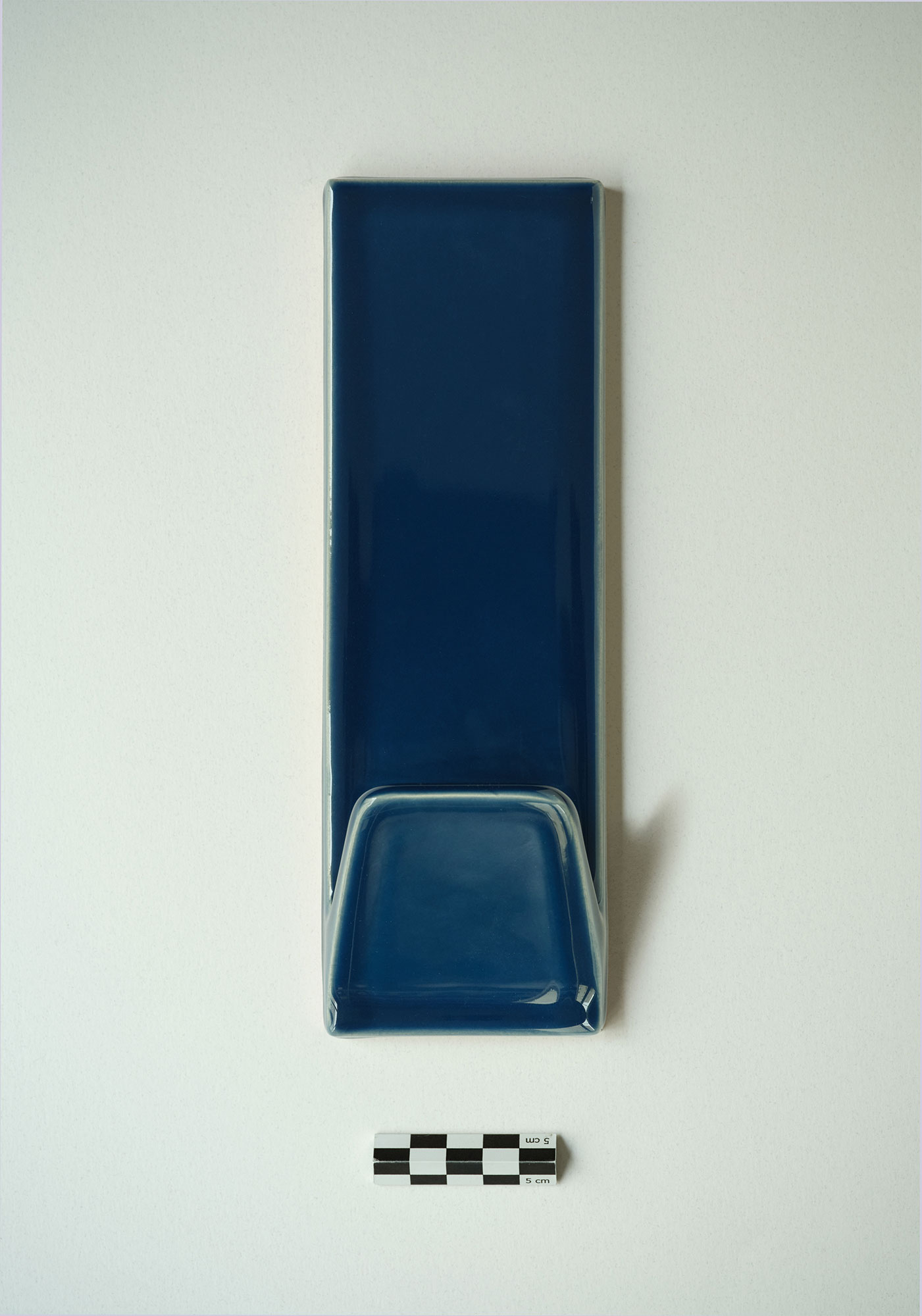 A Deep blue ceramic hook packshot.